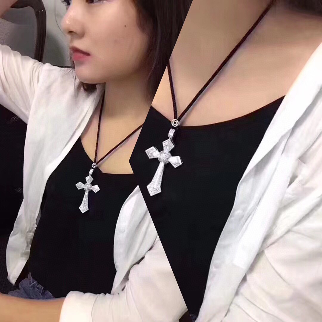Cartier Diamond Cross Pendant pendant White gold with clear baguette and round diamonds black cord 24 inch black cord chain