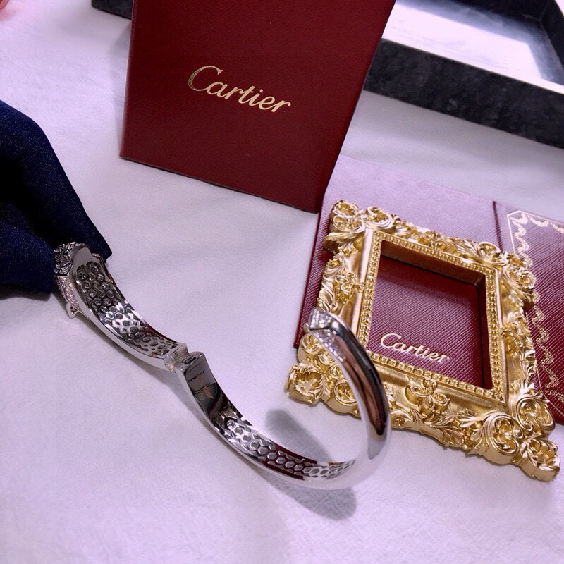 Cartier Panthere de Cartier bracelet 18k white gold 18k rose gold pave diamonds emerald eyes black onyx accents 17cm