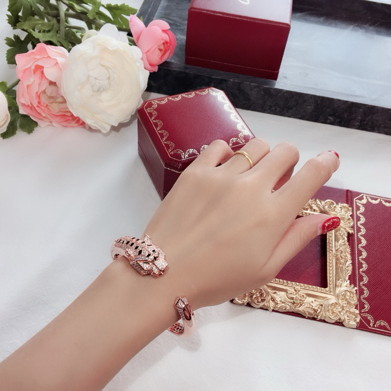 Cartier Panthere de Cartier bracelet 18k white gold 18k rose gold pave diamonds emerald eyes black onyx accents 17cm
