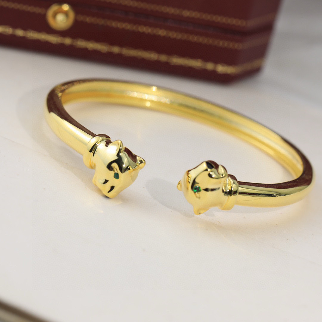Cartier Panthere de Cartier bracelet Yellow gold with green tsavorite garnet and black onyx accents 17