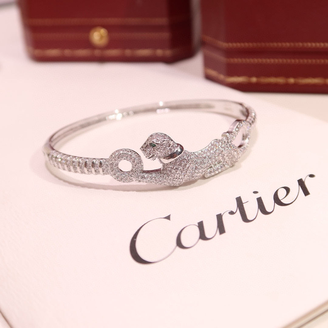 Cartier Panthere de Cartier bracelet 18K white gold pave diamonds tsavorite garnet eyes black onyx nose 17