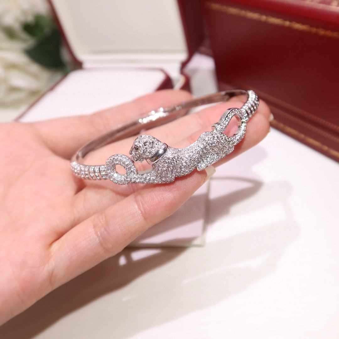 Cartier Panthere de Cartier bracelet 18K white gold pave diamonds tsavorite garnet eyes black onyx nose 17