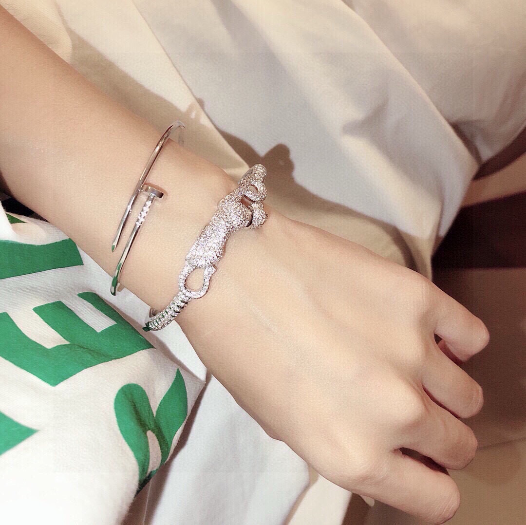 Cartier Panthere de Cartier bracelet 18K white gold pave diamonds tsavorite garnet eyes black onyx nose 17