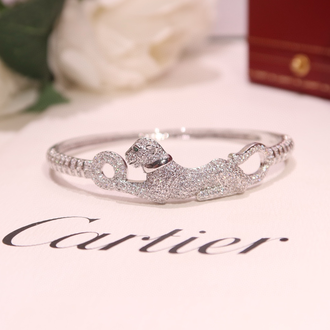 Cartier Panthere de Cartier bracelet 18K white gold pave diamonds tsavorite garnet eyes black onyx nose 17