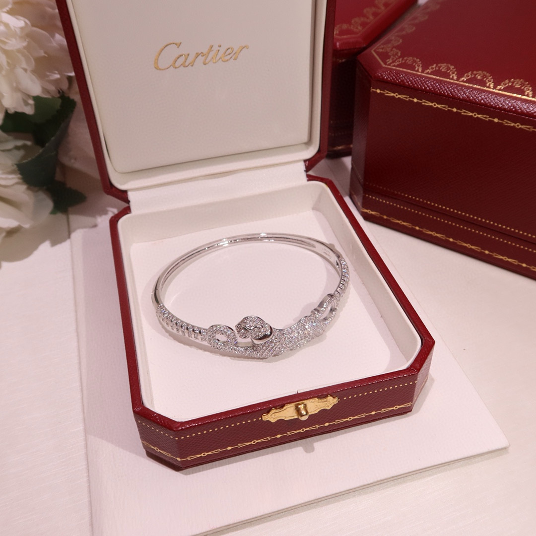 Cartier Panthere de Cartier bracelet 18K white gold pave diamonds tsavorite garnet eyes black onyx nose 17