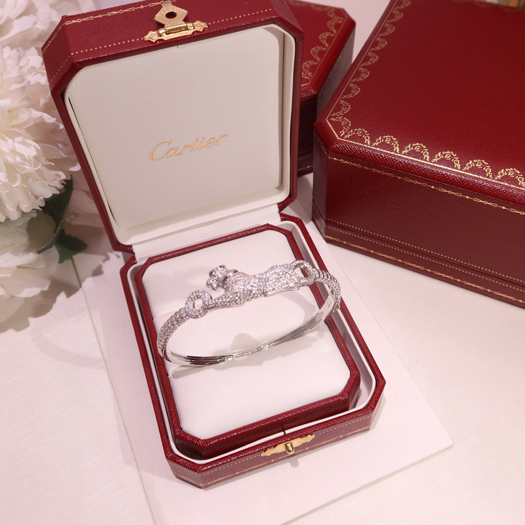 Cartier Panthere de Cartier bracelet 18K white gold pave diamonds tsavorite garnet eyes black onyx nose 17
