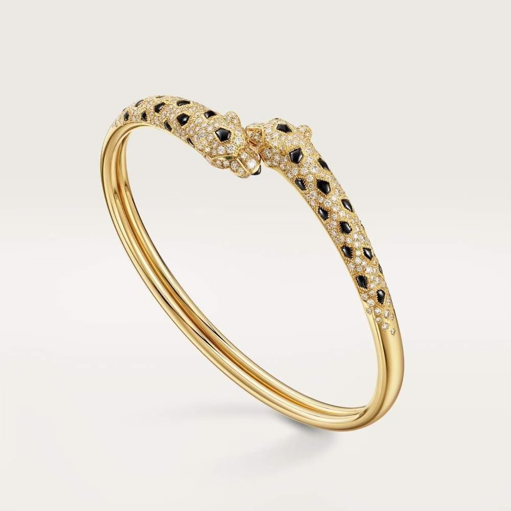 Cartier Panthere de Cartier bracelet 18K yellow gold paved with diamonds black onyx spots emerald eyes 17