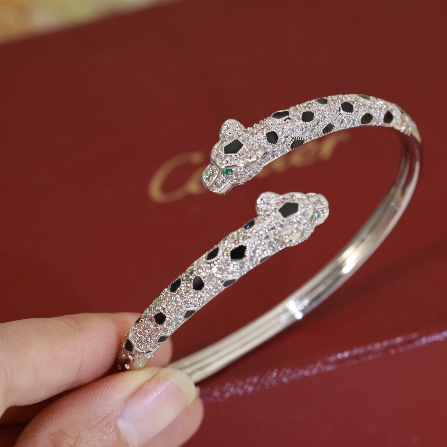 Cartier Panthere de Cartier bracelet 18K yellow gold paved with diamonds black onyx spots emerald eyes 17