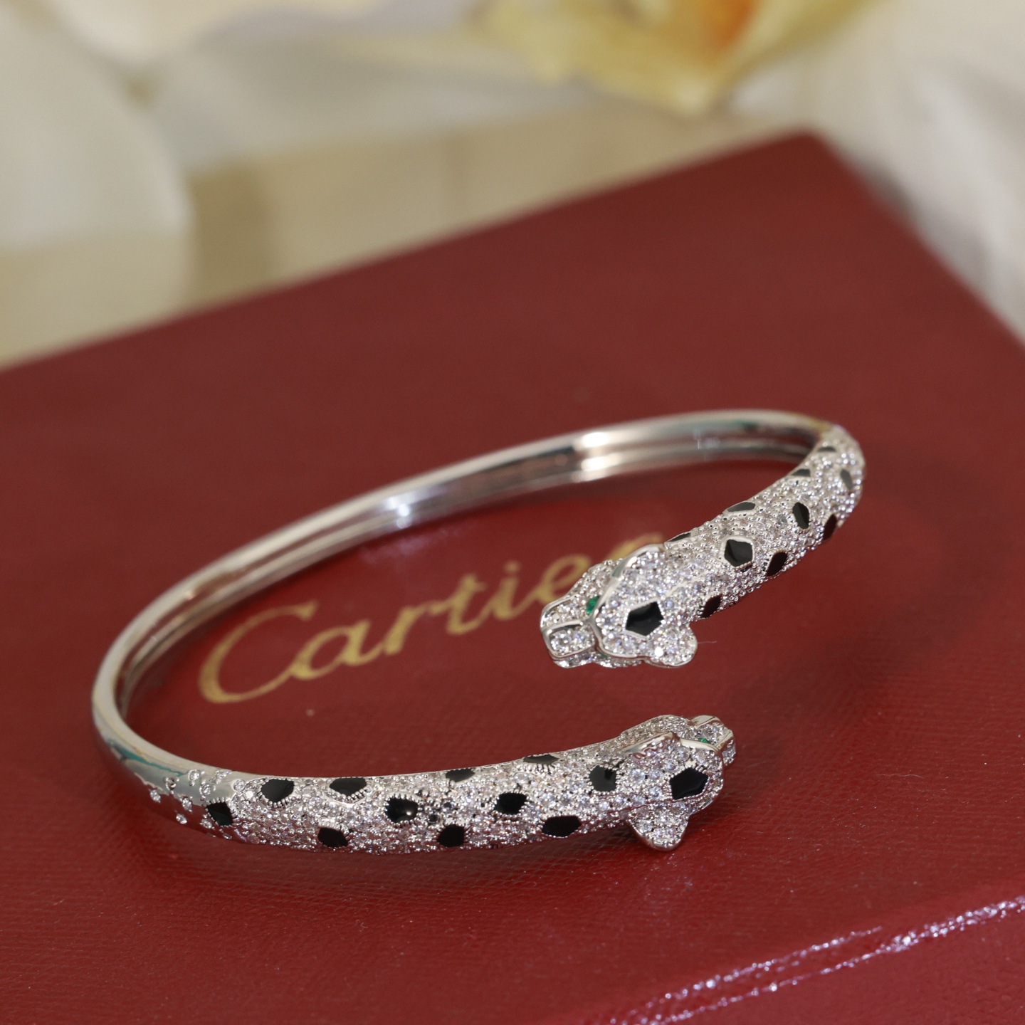 Cartier Panthere de Cartier bracelet 18K yellow gold paved with diamonds black onyx spots emerald eyes 17