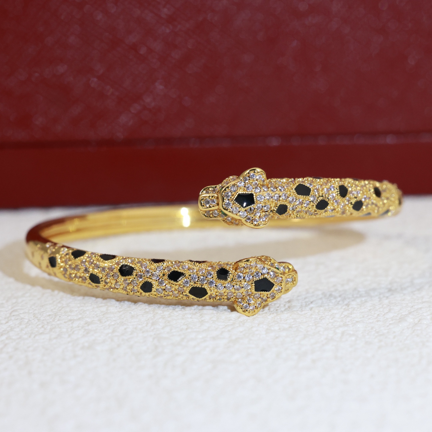 Cartier Panthere de Cartier bracelet 18K yellow gold paved with diamonds black onyx spots emerald eyes 17