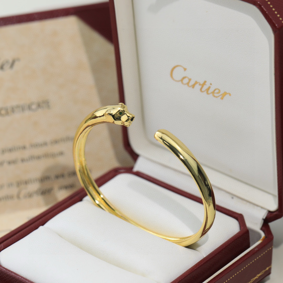 Cartier Panthere de Cartier bracelet 18K white gold 18K yellow gold 18K rose gold green tsavorite garnet eyes black onyx nose accents 17