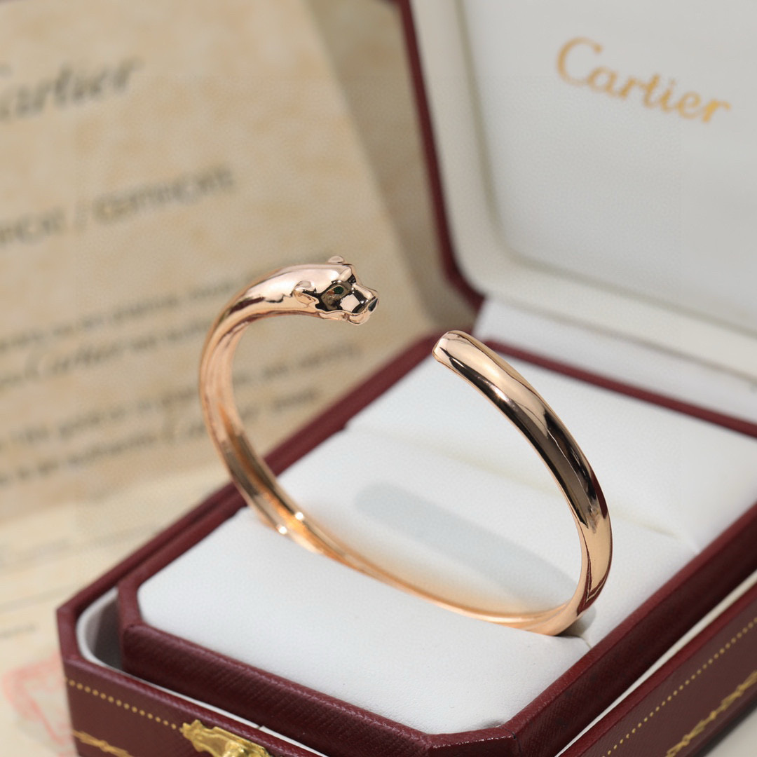 Cartier Panthere de Cartier bracelet 18K white gold 18K yellow gold 18K rose gold green tsavorite garnet eyes black onyx nose accents 17