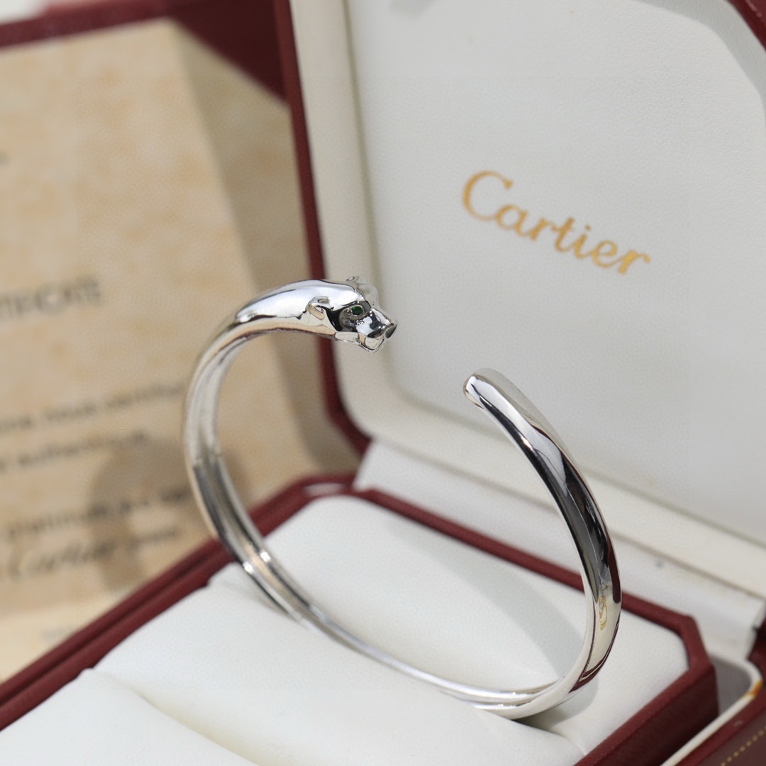 Cartier Panthere de Cartier bracelet 18K white gold 18K yellow gold 18K rose gold green tsavorite garnet eyes black onyx nose accents 17