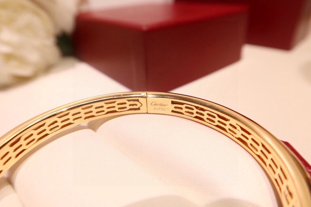 Cartier Panthere de Cartier bracelet 18K yellow gold set with diamonds black onyx spots tsavorite garnet eyes 17