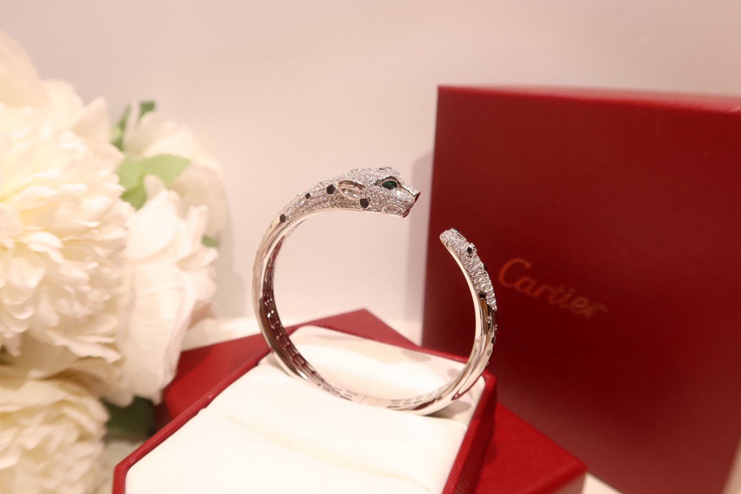 Cartier Panthere de Cartier bracelet 18K yellow gold set with diamonds black onyx spots tsavorite garnet eyes 17