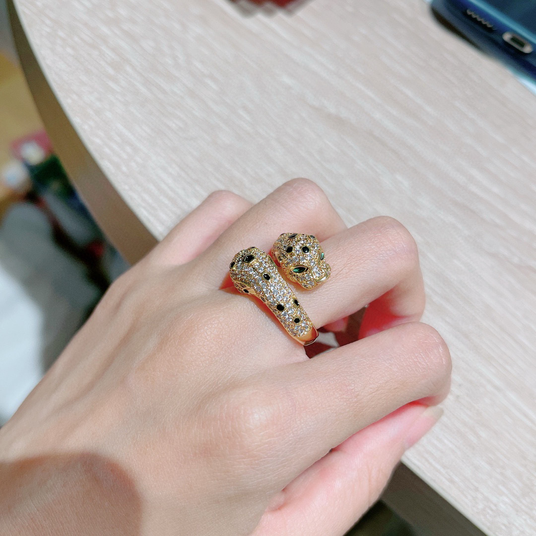 Cartier Panthere de Cartier ring 18K yellow gold pave set clear diamonds black onyx spots green tsavorite garnet eyes US 7