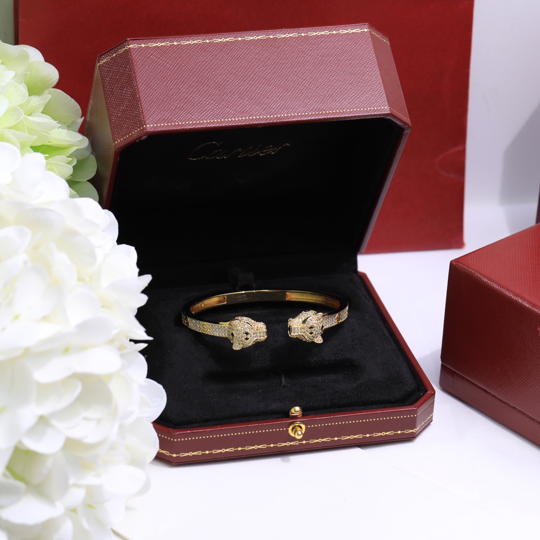 Cartier Panthere de Cartier bracelet 18K yellow gold set with diamonds black onyx green emerald 17