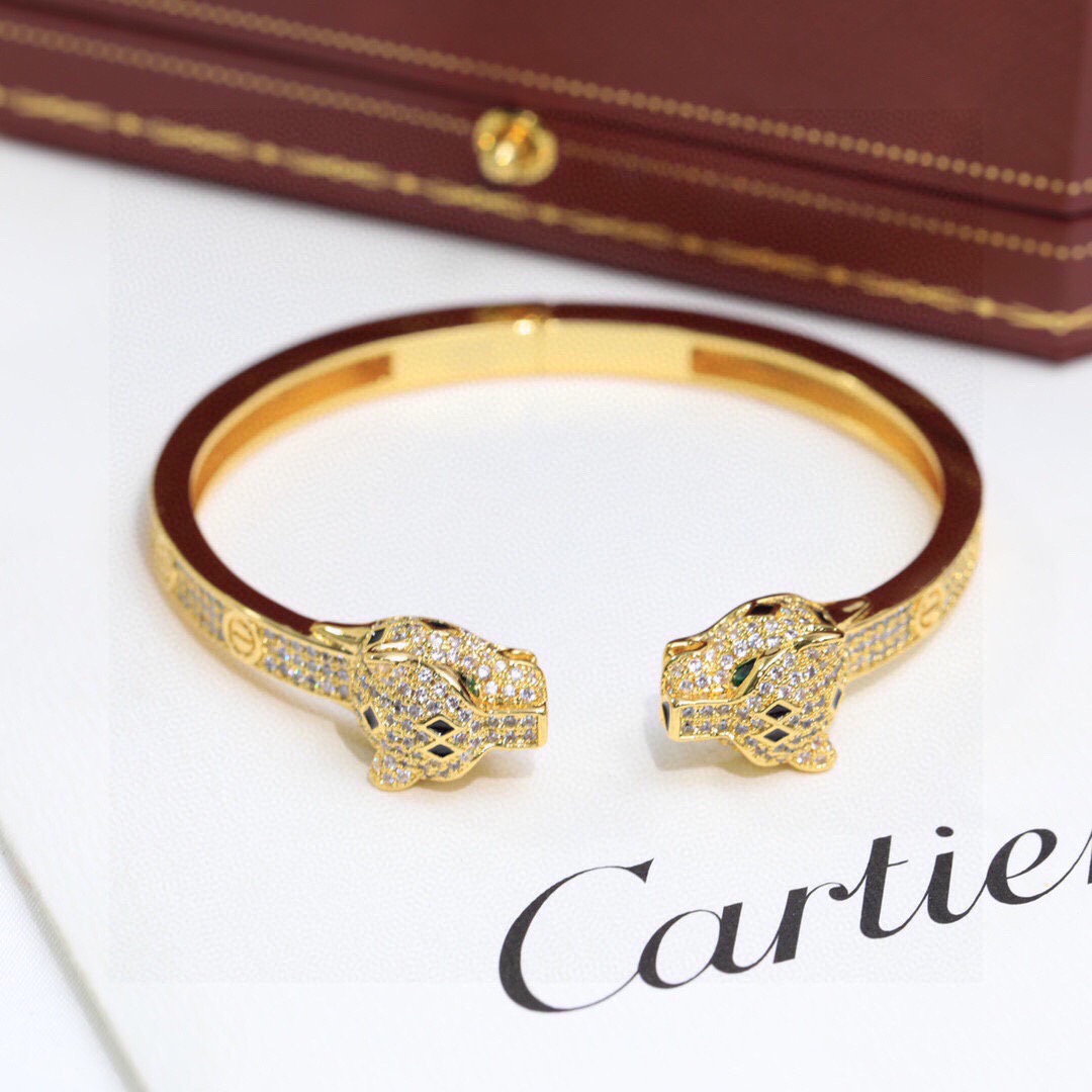 Cartier Panthere de Cartier bracelet 18K yellow gold set with diamonds black onyx green emerald 17