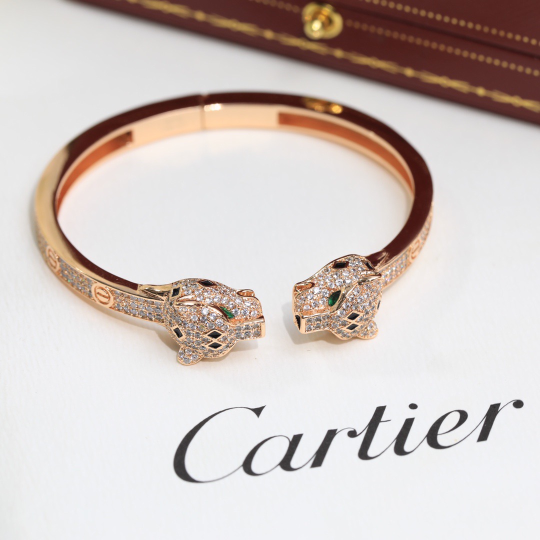 Cartier Panthere de Cartier bracelet 18K yellow gold set with diamonds black onyx green emerald 17