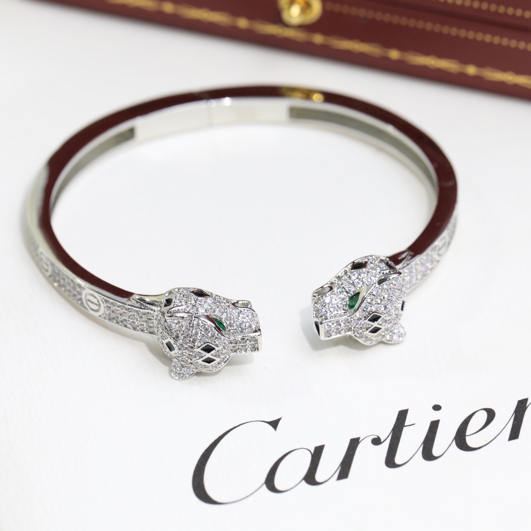 Cartier Panthere de Cartier bracelet 18K yellow gold set with diamonds black onyx green emerald 17