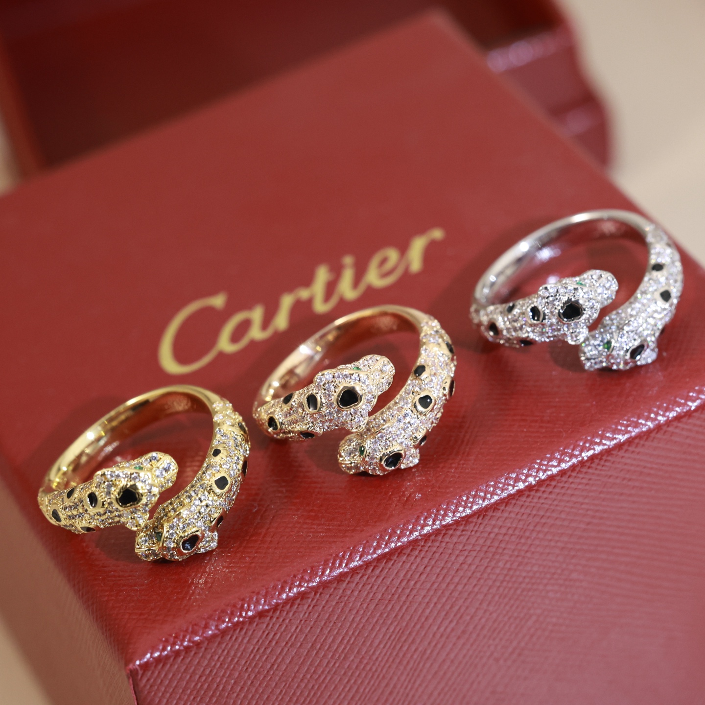 Cartier Panthere de Cartier ring 18K rose gold 18K yellow gold 18K white gold colorless diamonds black onyx tsavorite garnet US 7