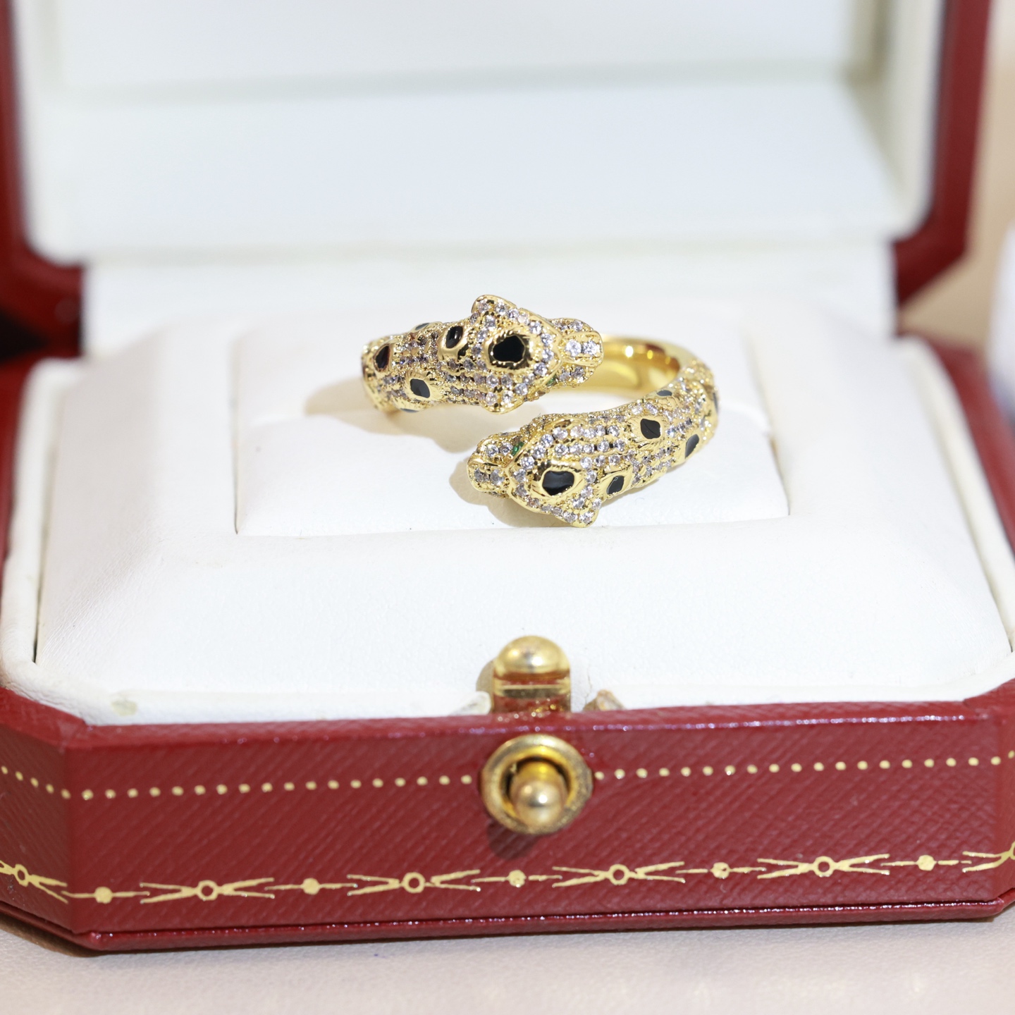 Cartier Panthere de Cartier ring 18K rose gold 18K yellow gold 18K white gold colorless diamonds black onyx tsavorite garnet US 7