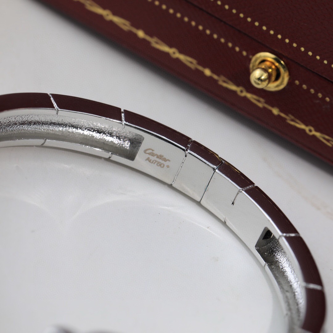 Cartier Panthere de Cartier bracelet 18K yellow gold with black lacquer spots and green tsavorite garnet eyes 17cm