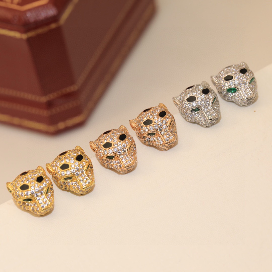 Cartier Panthere de Cartier earrings 18k yellow gold clear pave diamonds black onyx spots emerald green eyes 10mm stud length