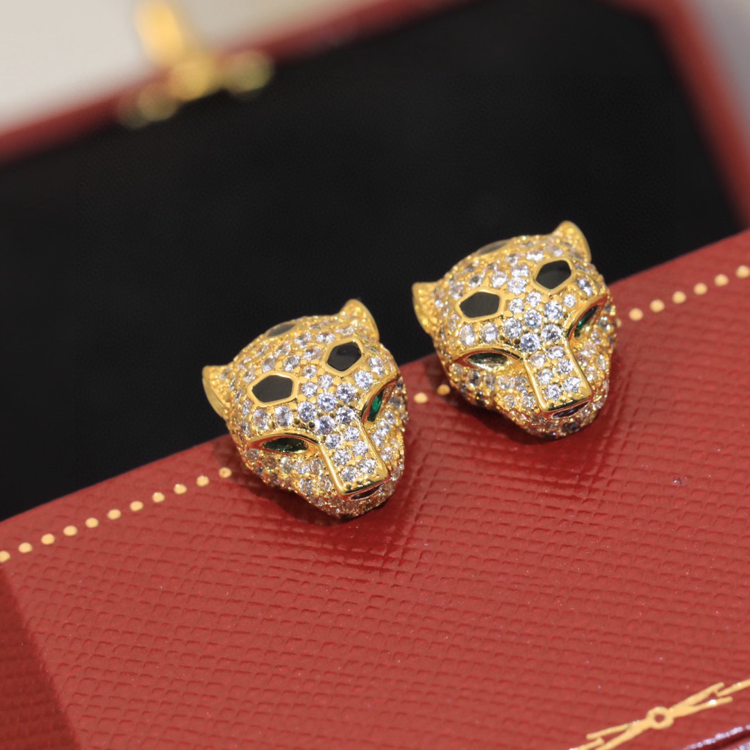 Cartier Panthere de Cartier earrings 18k yellow gold clear pave diamonds black onyx spots emerald green eyes 10mm stud length