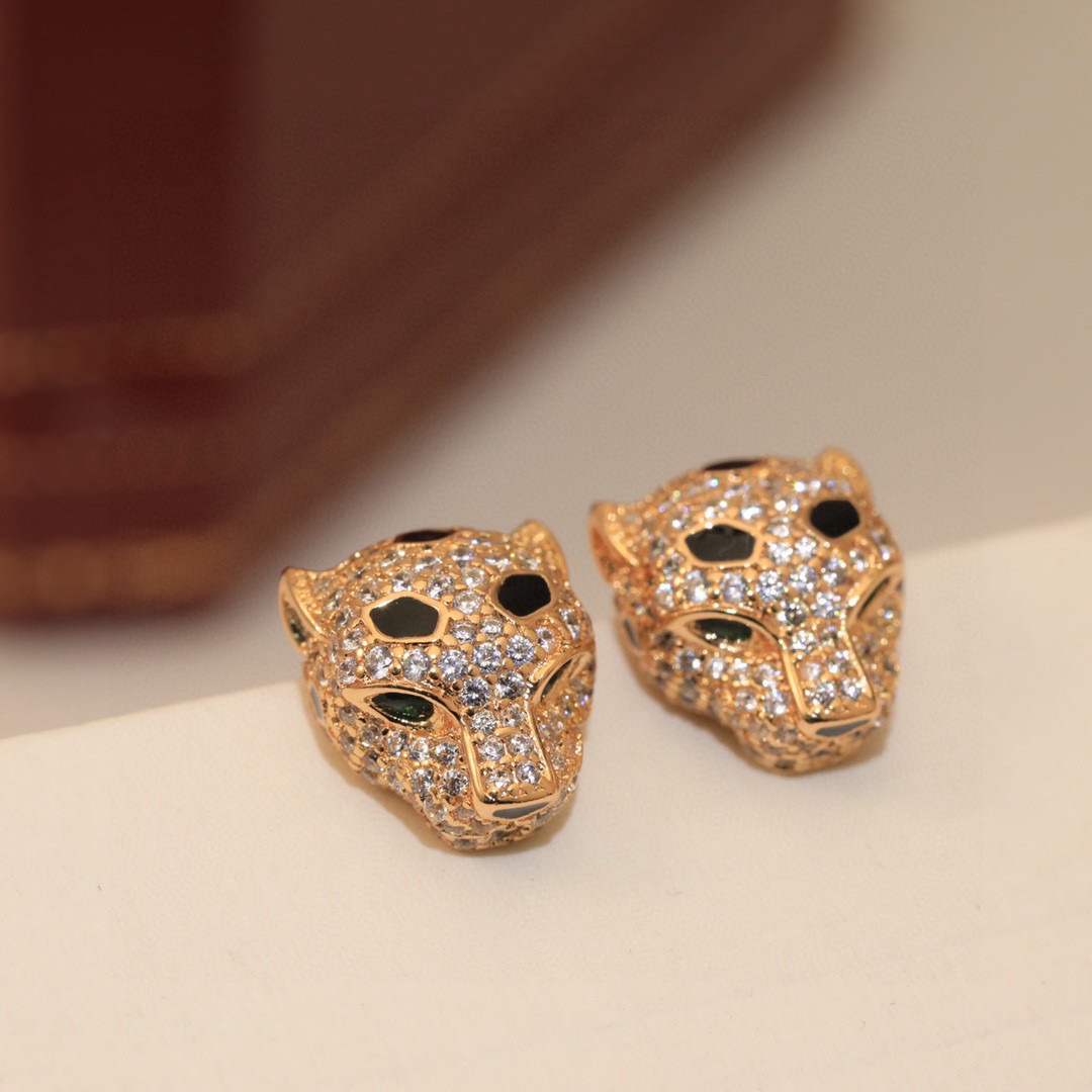 Cartier Panthere de Cartier earrings 18k yellow gold clear pave diamonds black onyx spots emerald green eyes 10mm stud length