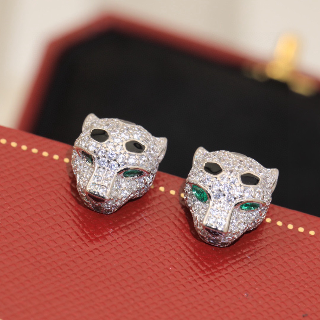 Cartier Panthere de Cartier earrings 18k yellow gold clear pave diamonds black onyx spots emerald green eyes 10mm stud length