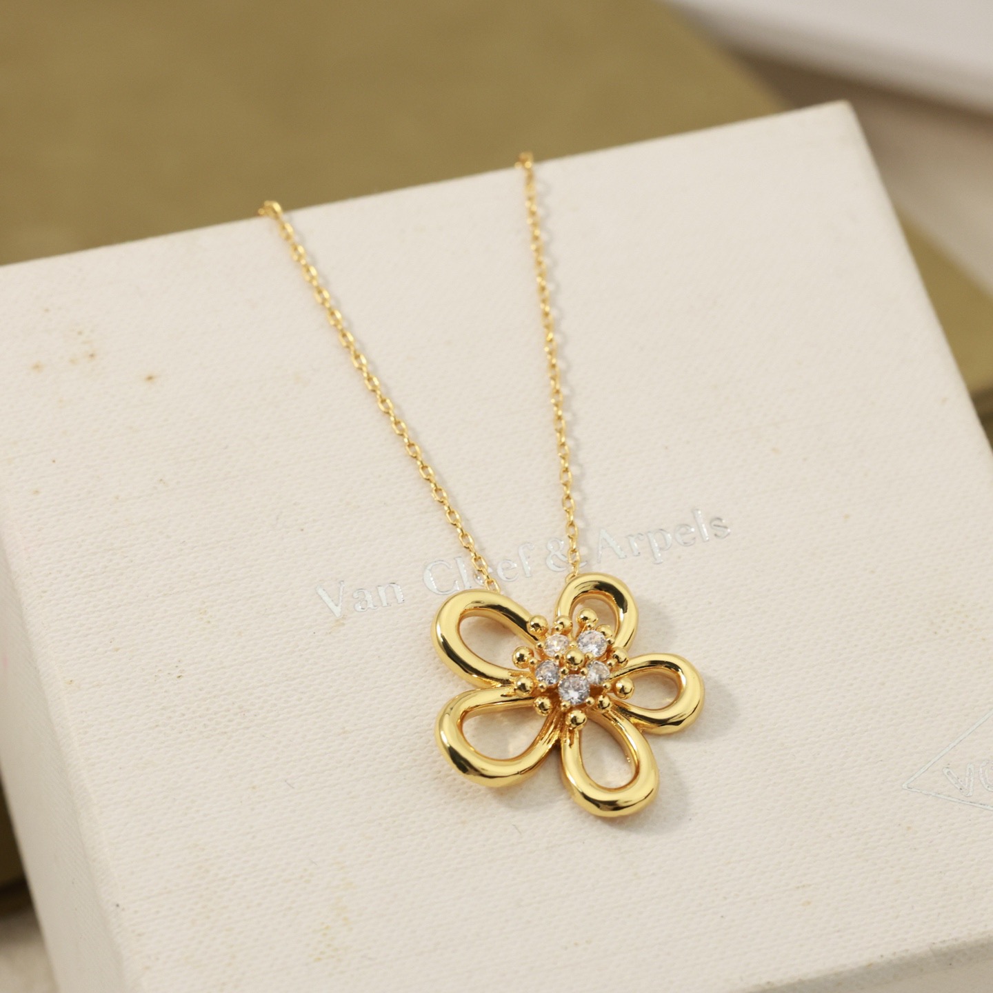 Van Cleef Arpels Flowerlace necklace 18K yellow gold with clear diamond accents 18K rose gold with clear diamond accents 18K white gold with clear diamond accents 42cm