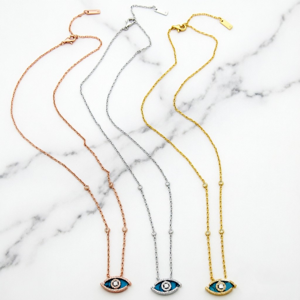 Messika Lucky Eye Evil Eye Pendant Necklace necklace Available in 18k rose gold 18k white gold 18k yellow gold set with malachite or turquoise accented with pave diamonds and a central diamond 42cm with 5cm extender