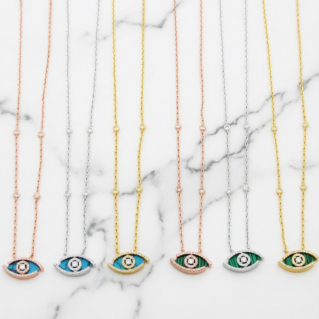 Messika Lucky Eye Evil Eye Pendant Necklace necklace Available in 18k rose gold 18k white gold 18k yellow gold set with malachite or turquoise accented with pave diamonds and a central diamond 42cm with 5cm extender