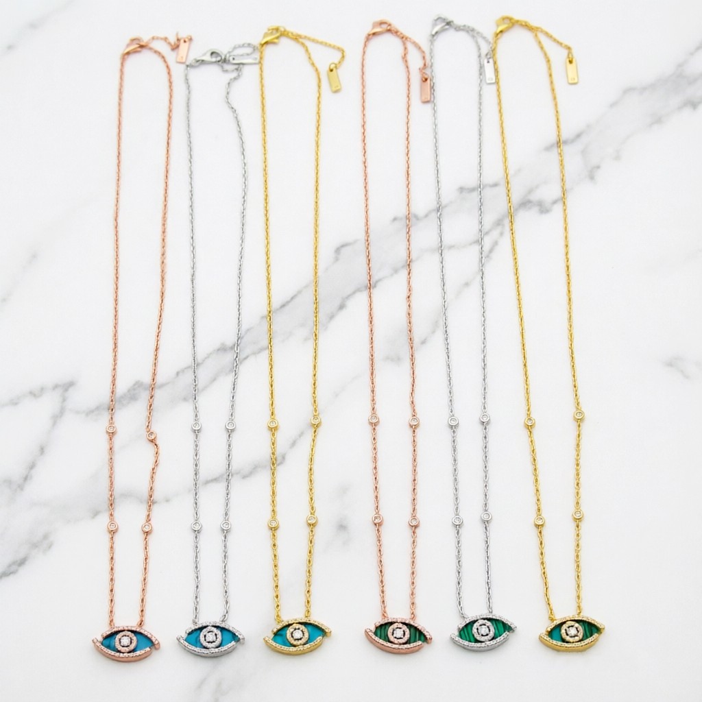 Messika Lucky Eye Evil Eye Pendant Necklace necklace Available in 18k rose gold 18k white gold 18k yellow gold set with malachite or turquoise accented with pave diamonds and a central diamond 42cm with 5cm extender