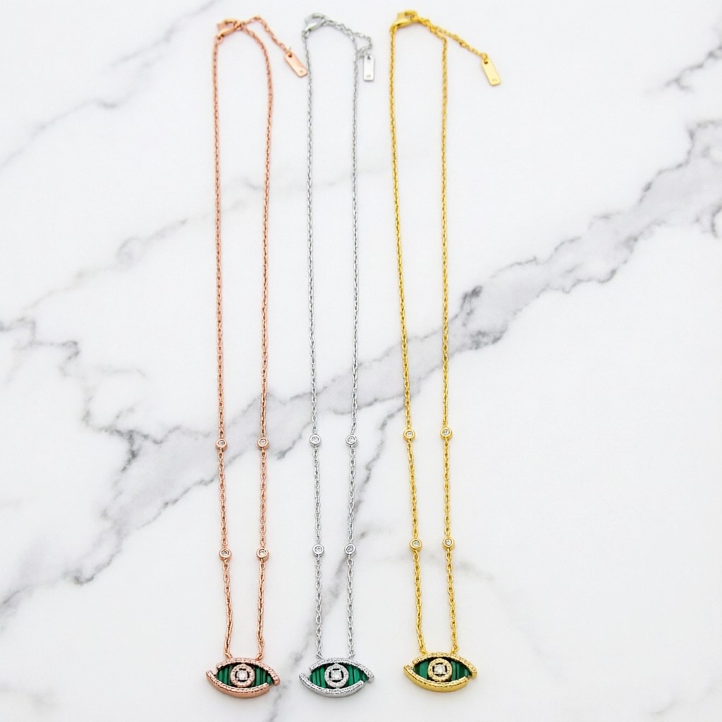 Messika Lucky Eye Evil Eye Pendant Necklace necklace Available in 18k rose gold 18k white gold 18k yellow gold set with malachite or turquoise accented with pave diamonds and a central diamond 42cm with 5cm extender