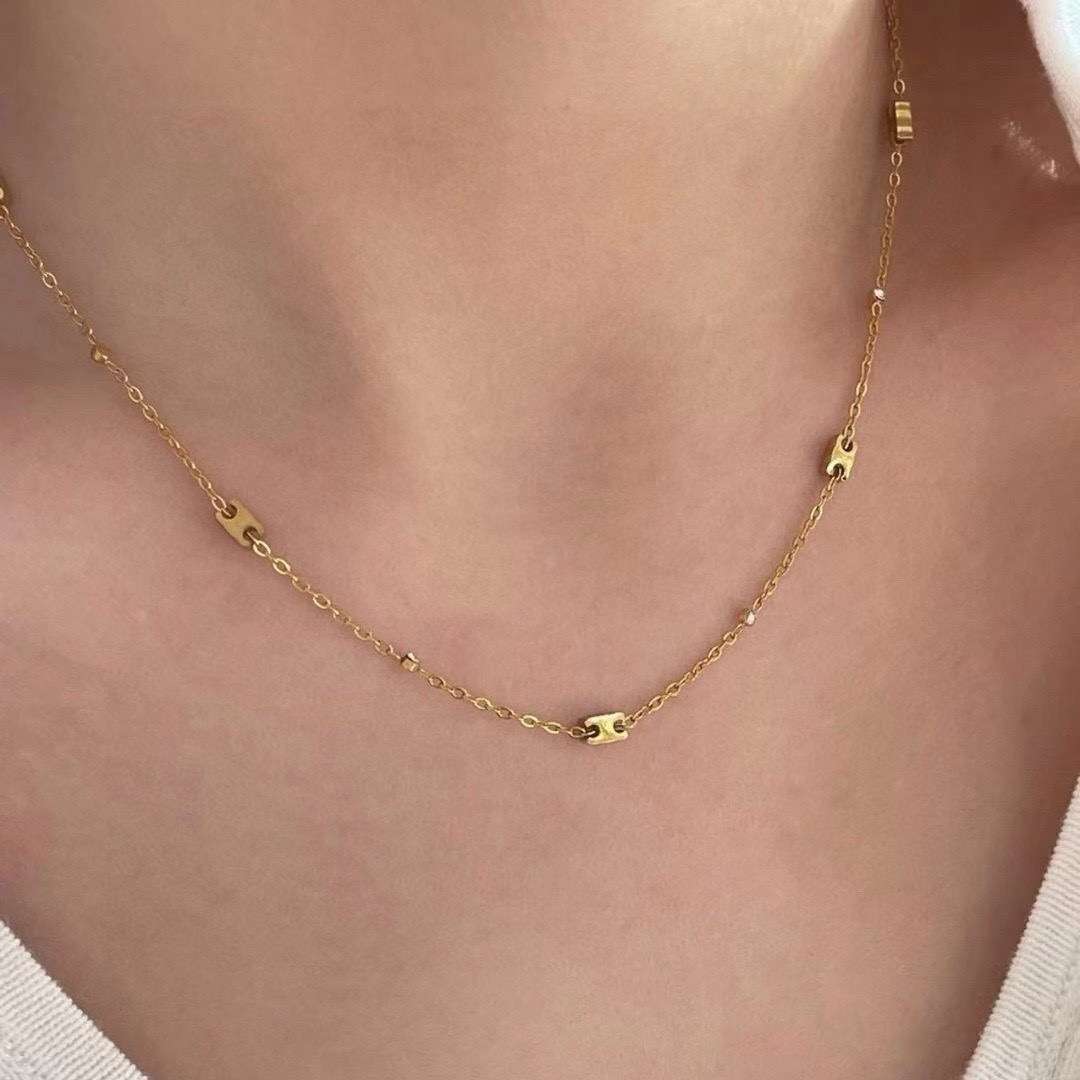 Celine Triomphe Mini Charms necklace gold-tone metal with clear crystal accents 40cm
