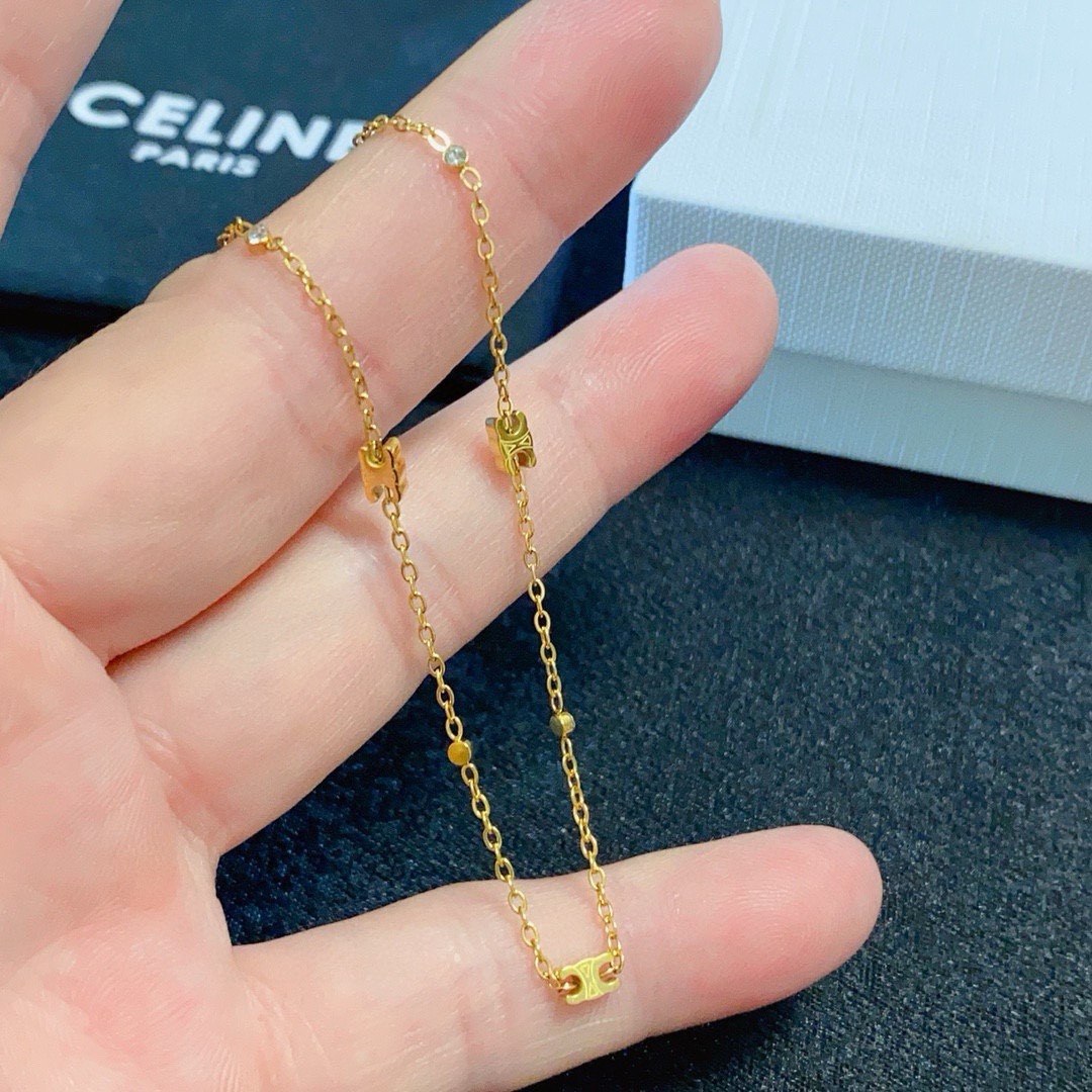 Celine Triomphe Mini Charms necklace gold-tone metal with clear crystal accents 40cm