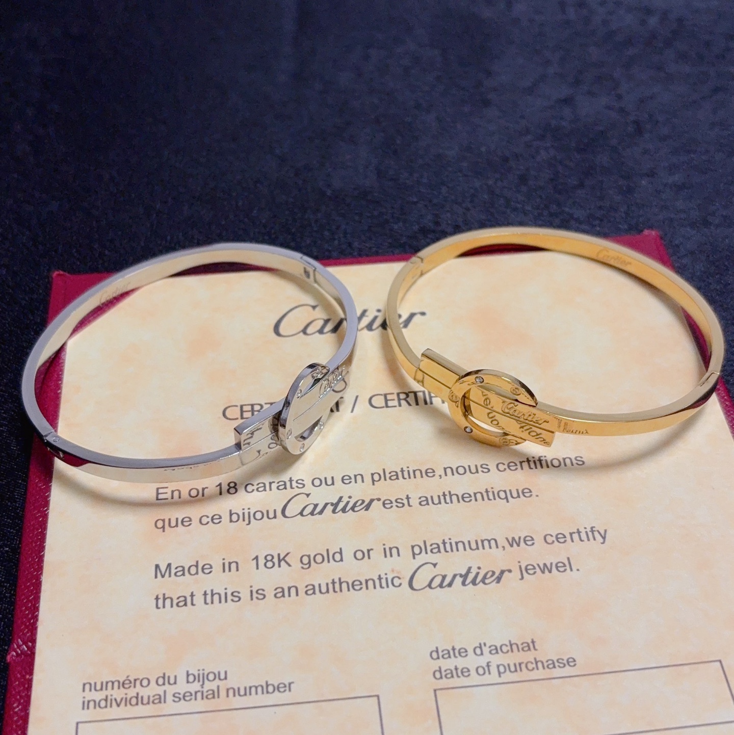 Cartier Love Interlocking Clasp Bangle bracelet 18k yellow gold with small clear diamond accents 18k white gold with small clear diamond accents 17cm inner circumference