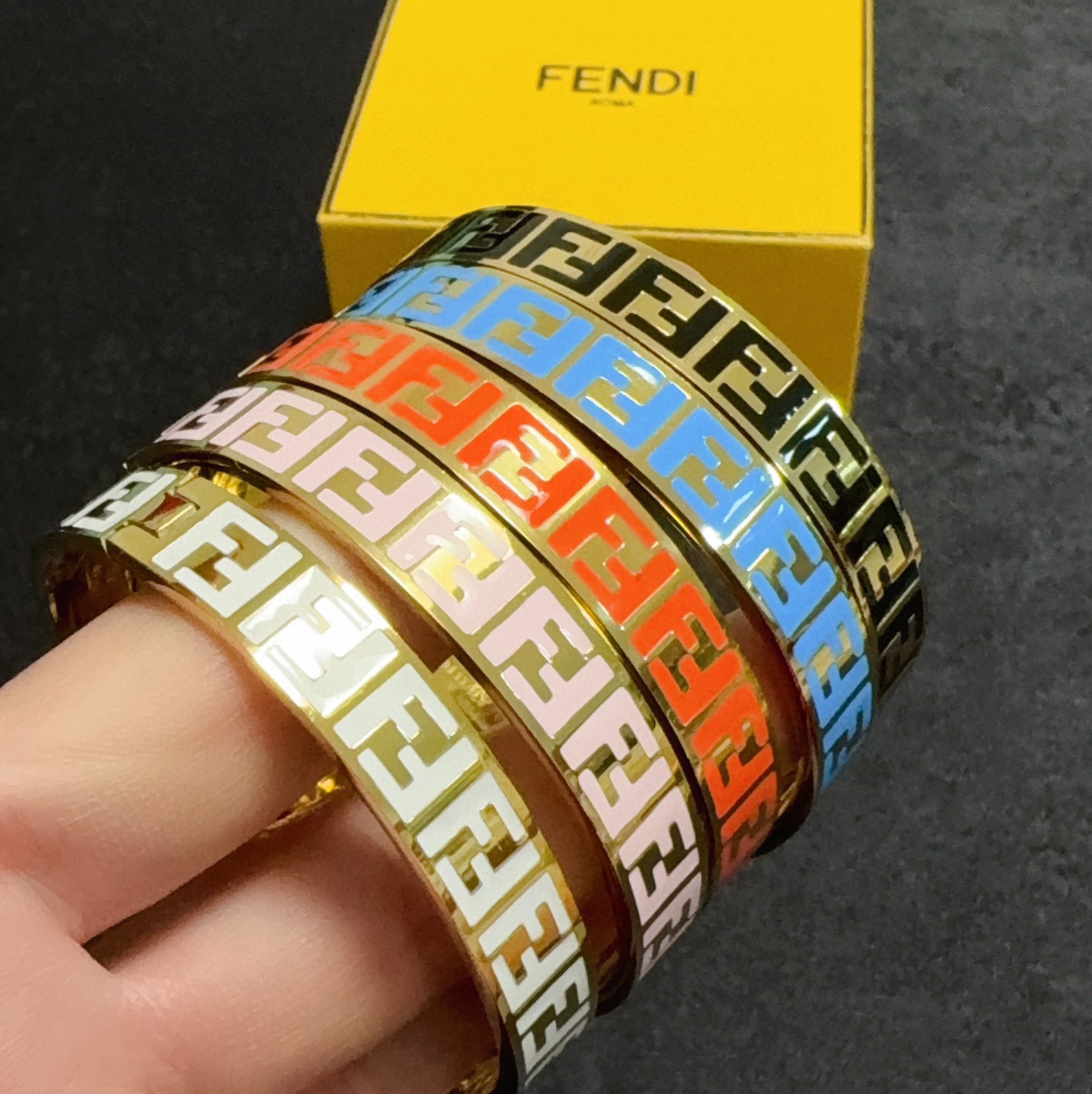 Fendi FF Logo Enamel Bangle bracelet gold-tone metal with black enamel FF monogram 17cm inner circumference
