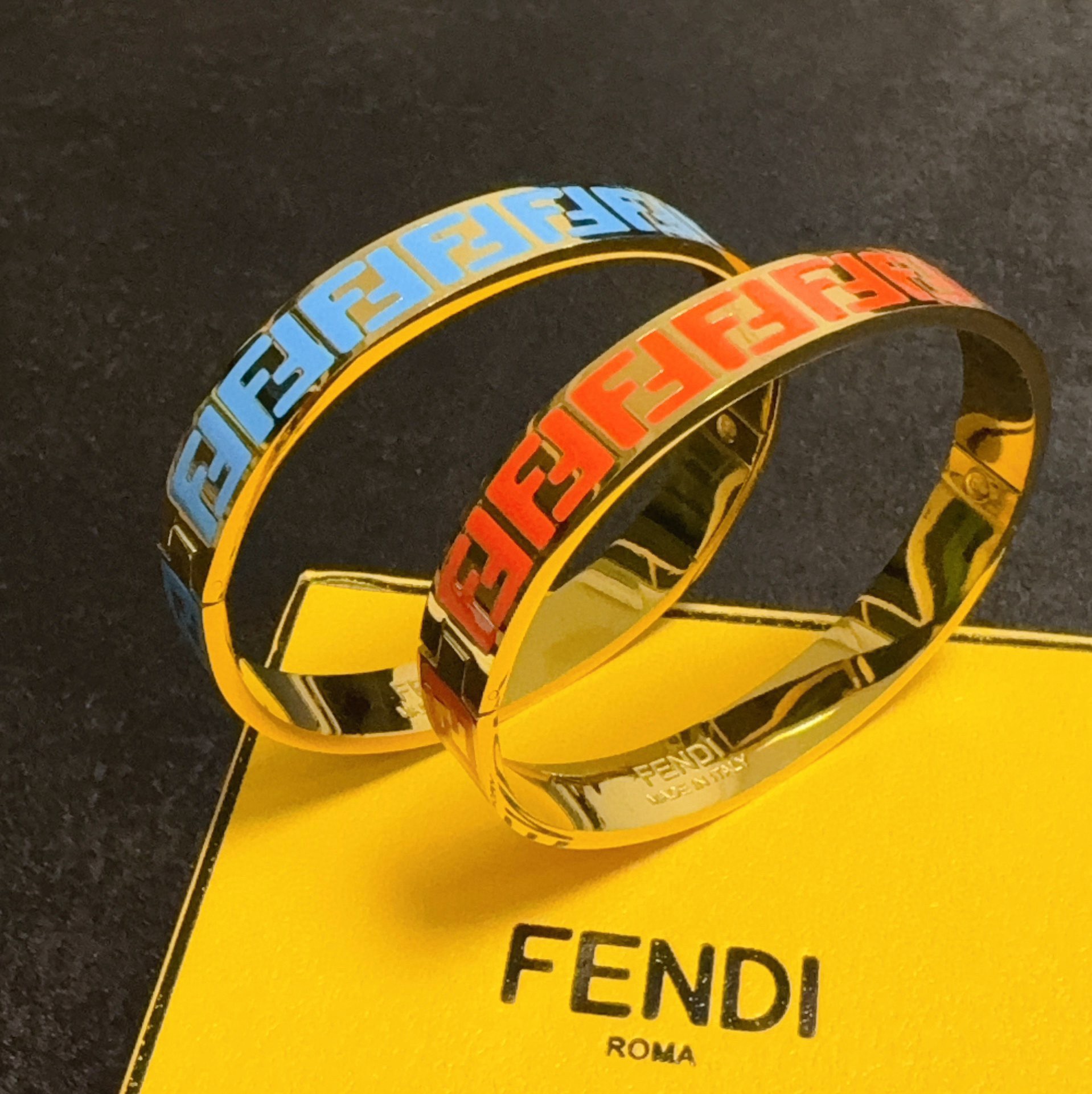 Fendi FF Logo Enamel Bangle bracelet gold-tone metal with black enamel FF monogram 17cm inner circumference