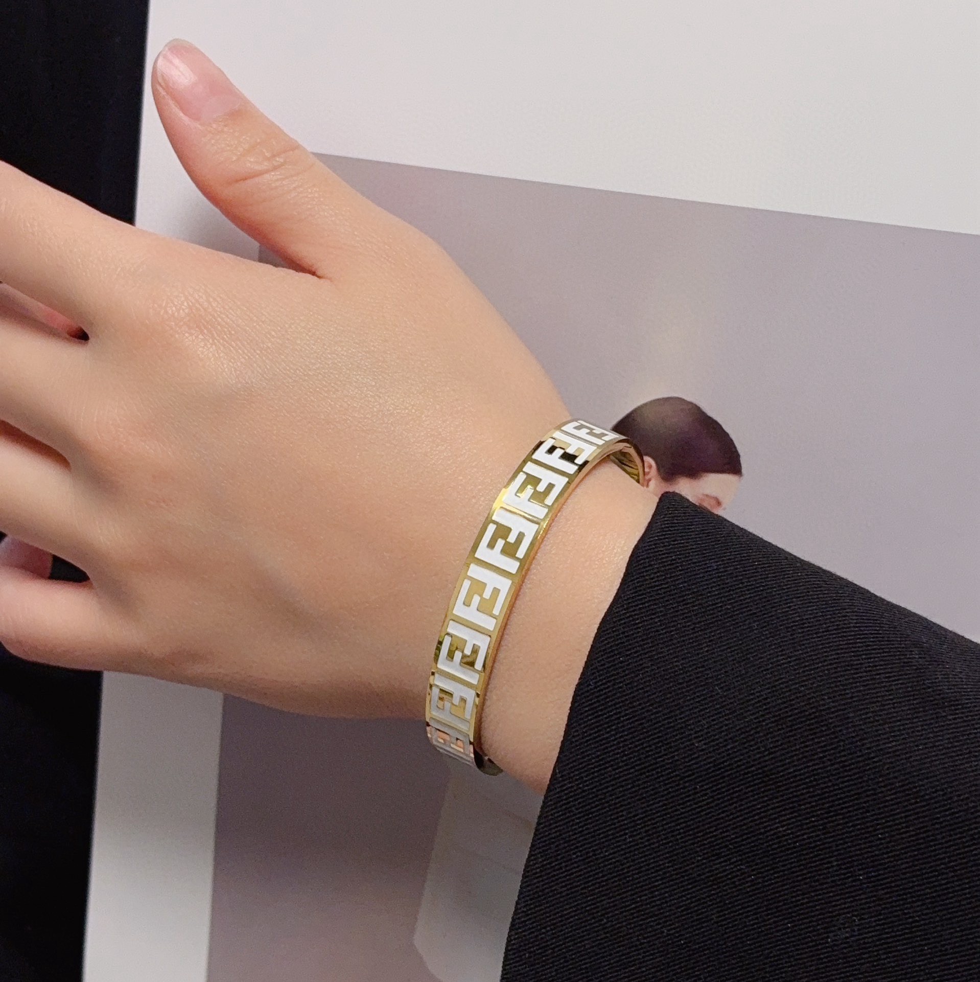 Fendi FF Logo Enamel Bangle bracelet gold-tone metal with black enamel FF monogram 17cm inner circumference