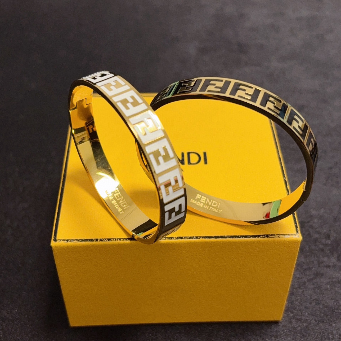 Fendi FF Logo Enamel Bangle bracelet gold-tone metal with black enamel FF monogram 17cm inner circumference