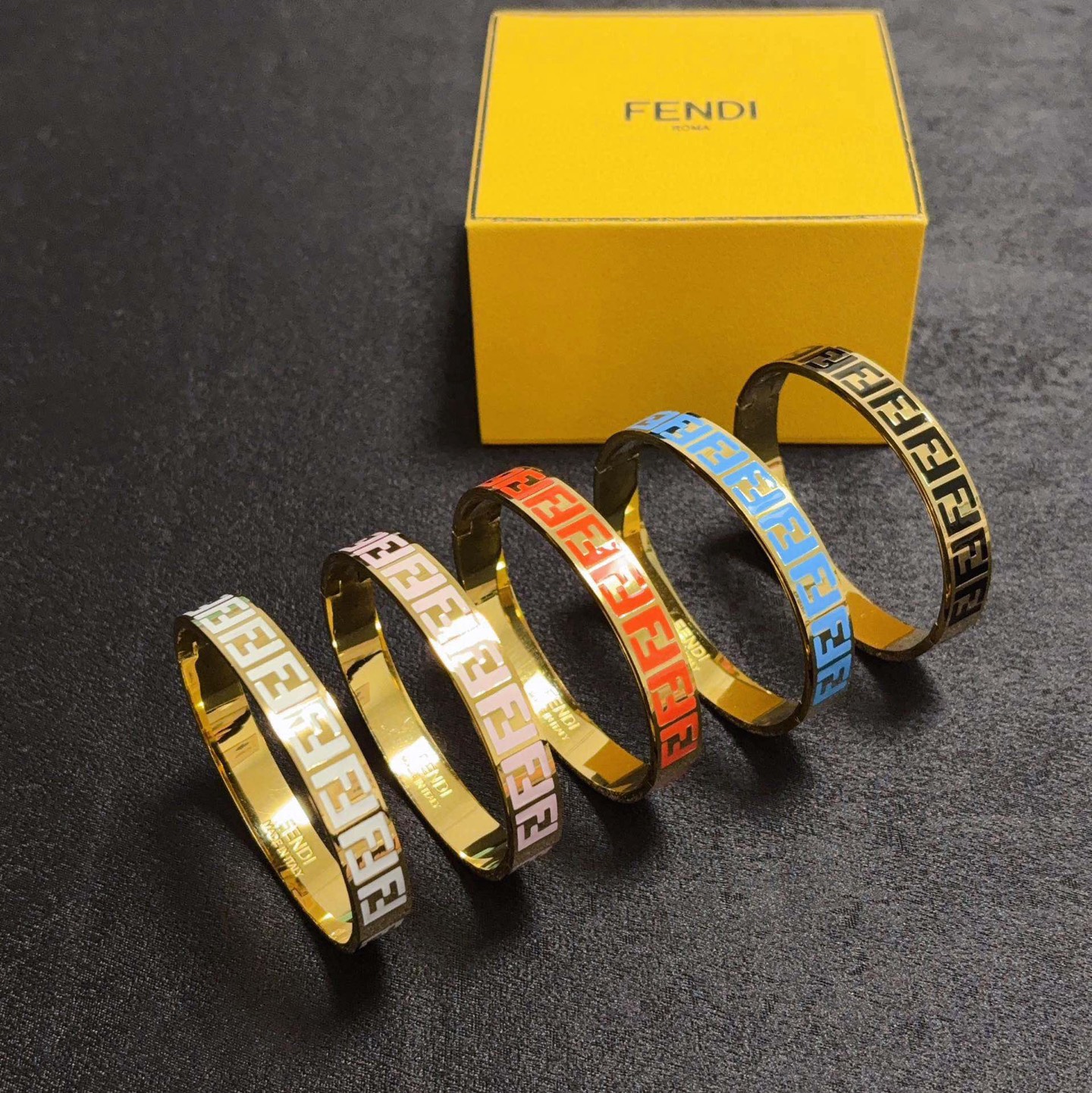 Fendi FF Logo Enamel Bangle bracelet gold-tone metal with black enamel FF monogram 17cm inner circumference