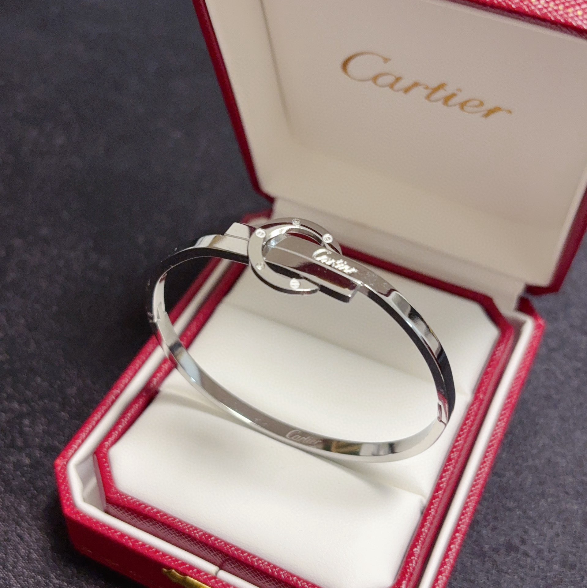 Cartier Love Interlocking Signature Bangle bracelet 18k yellow gold with diamond accents 18k white gold with diamond accents 17cm inner circumference