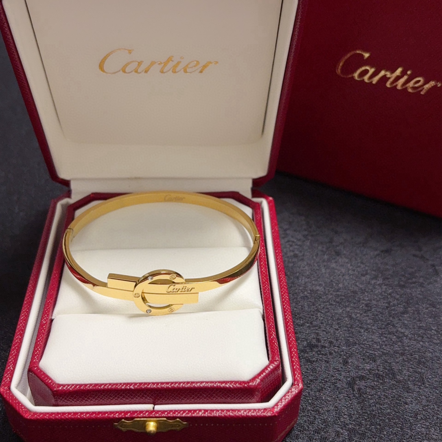 Cartier Love Interlocking Signature Bangle bracelet 18k yellow gold with diamond accents 18k white gold with diamond accents 17cm inner circumference