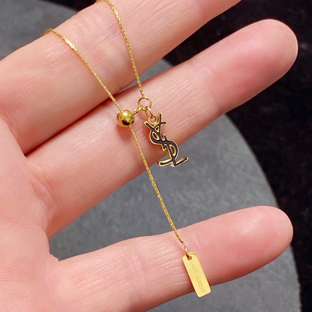 Saint Laurent Cassandre YSL Lariat necklace gold-tone metal with black enamel logo detail 40cm with 5cm extender