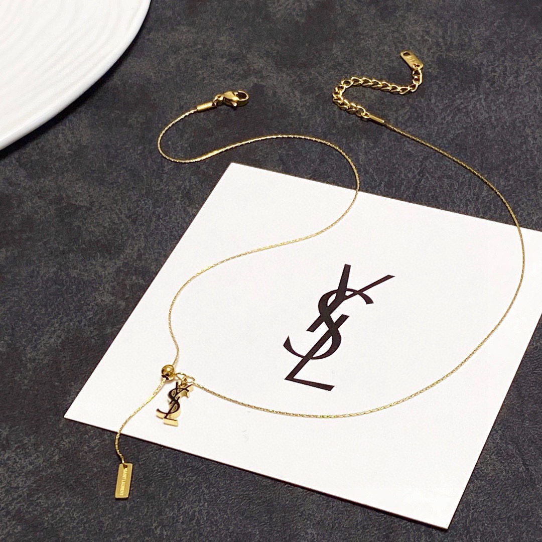Saint Laurent Cassandre YSL Lariat necklace gold-tone metal with black enamel logo detail 40cm with 5cm extender