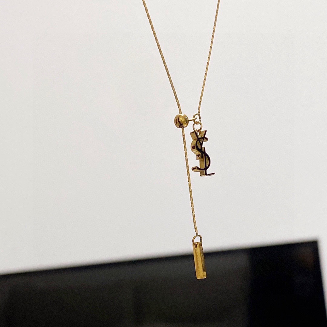 Saint Laurent Cassandre YSL Lariat necklace gold-tone metal with black enamel logo detail 40cm with 5cm extender