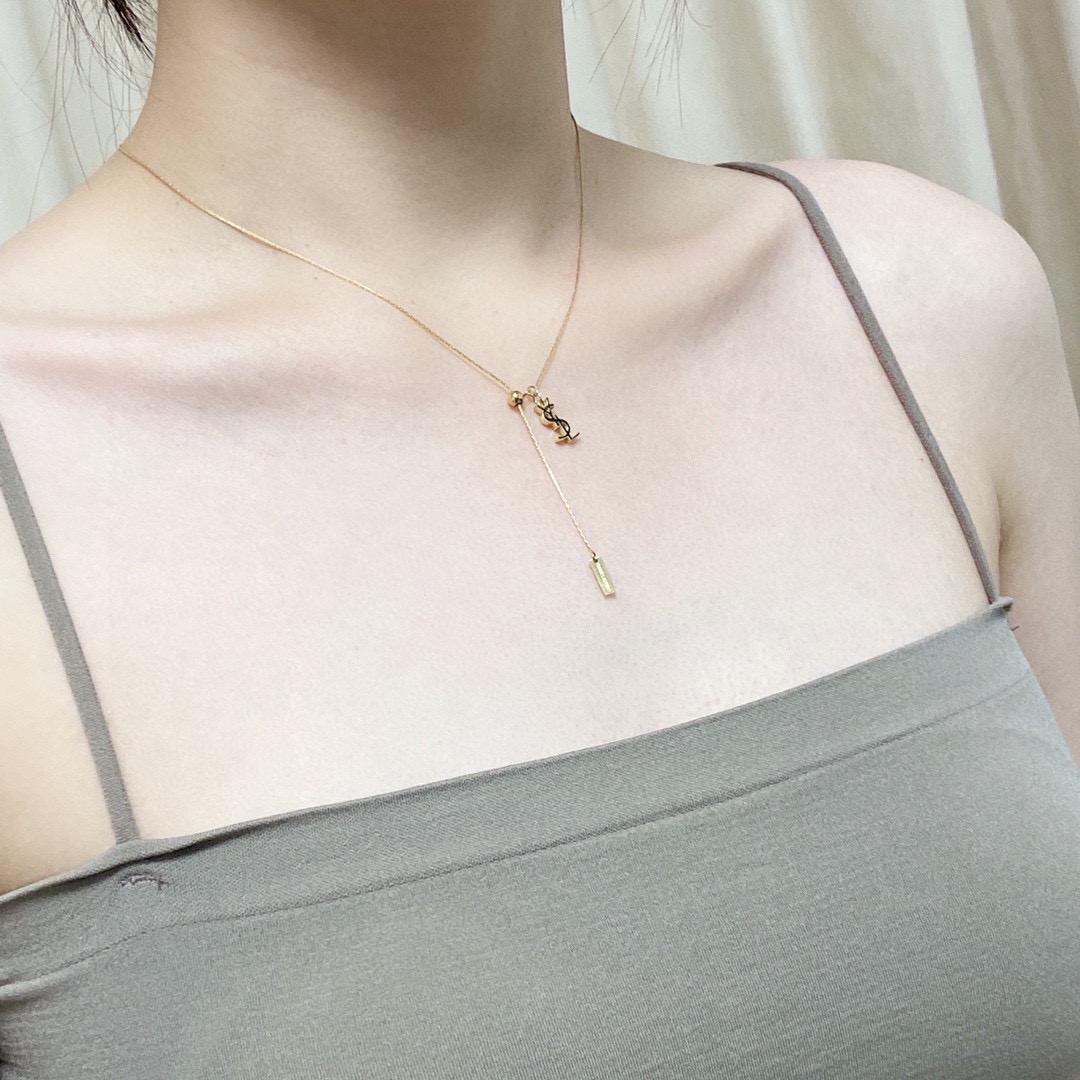 Saint Laurent Cassandre YSL Lariat necklace gold-tone metal with black enamel logo detail 40cm with 5cm extender